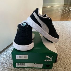 Black and white suade classic pumas